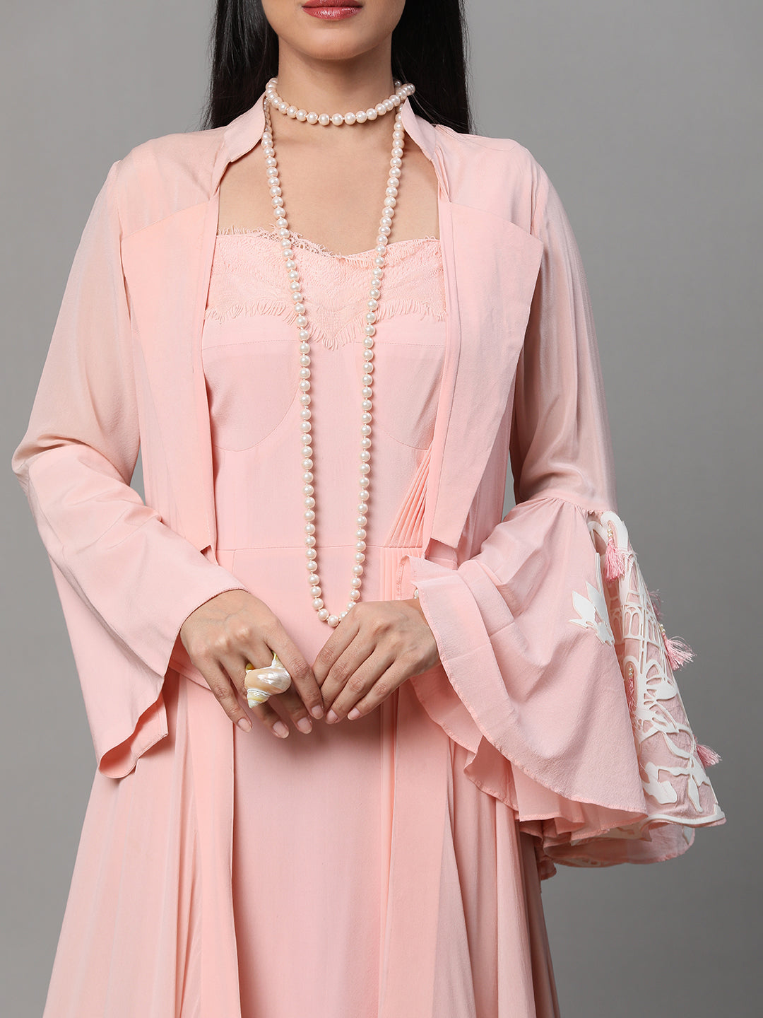 CREPE GOWN WITH A GRACEFUL CAPE